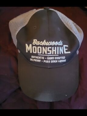 Backwoods Moonshine Trucker Hat - Olive with White Embroidery